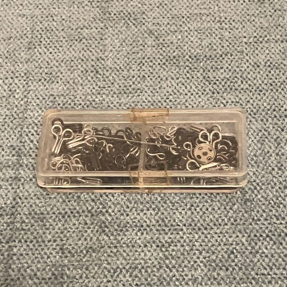 Container of Snaps and Fasteners